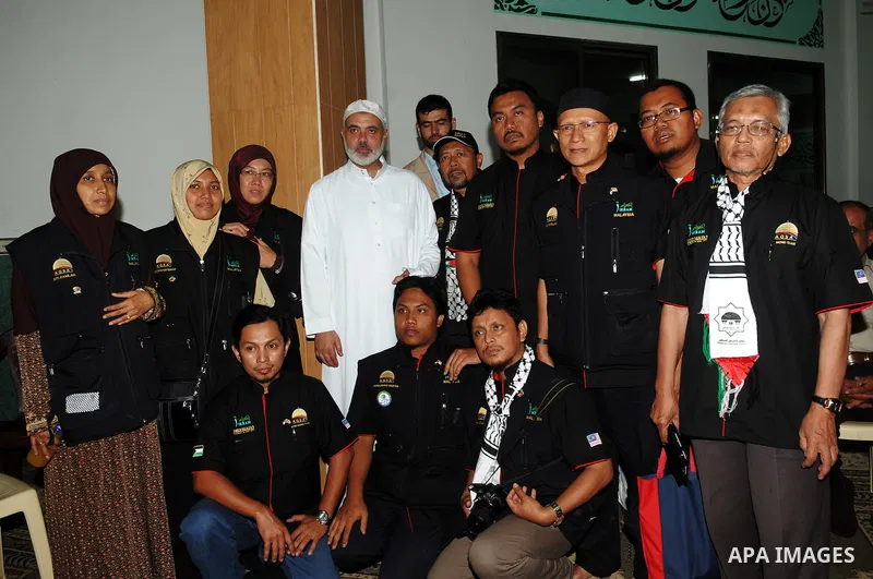 Palestinian Prime Minister in Gaza Strip, Ismail Haniya meets with a Malaysian delegation at mosque in Gaza city on August 24,2011. Photo by Ahmad Shaat