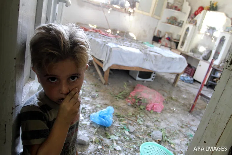 Palestinians inspect the damage in the kindergarten that was destroyed by an overnight Israeli air raid in Beit Lahia, on August 25, 2011. A series of Israeli air strikes on Gaza over the past 24 hours have killed five P...
