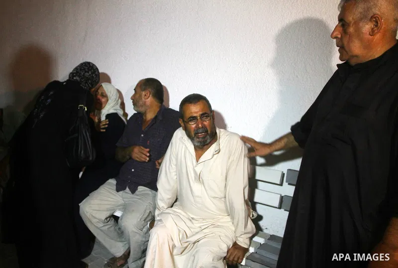 Palestinians mourn the body of Salem al-Arabed following an Israeli air strike killing two Islamic Jihad militants, at the main road in Jabaliya, northern Gaza Strip, Thursday, Aug. 25, 2011. Palestinian official said th...