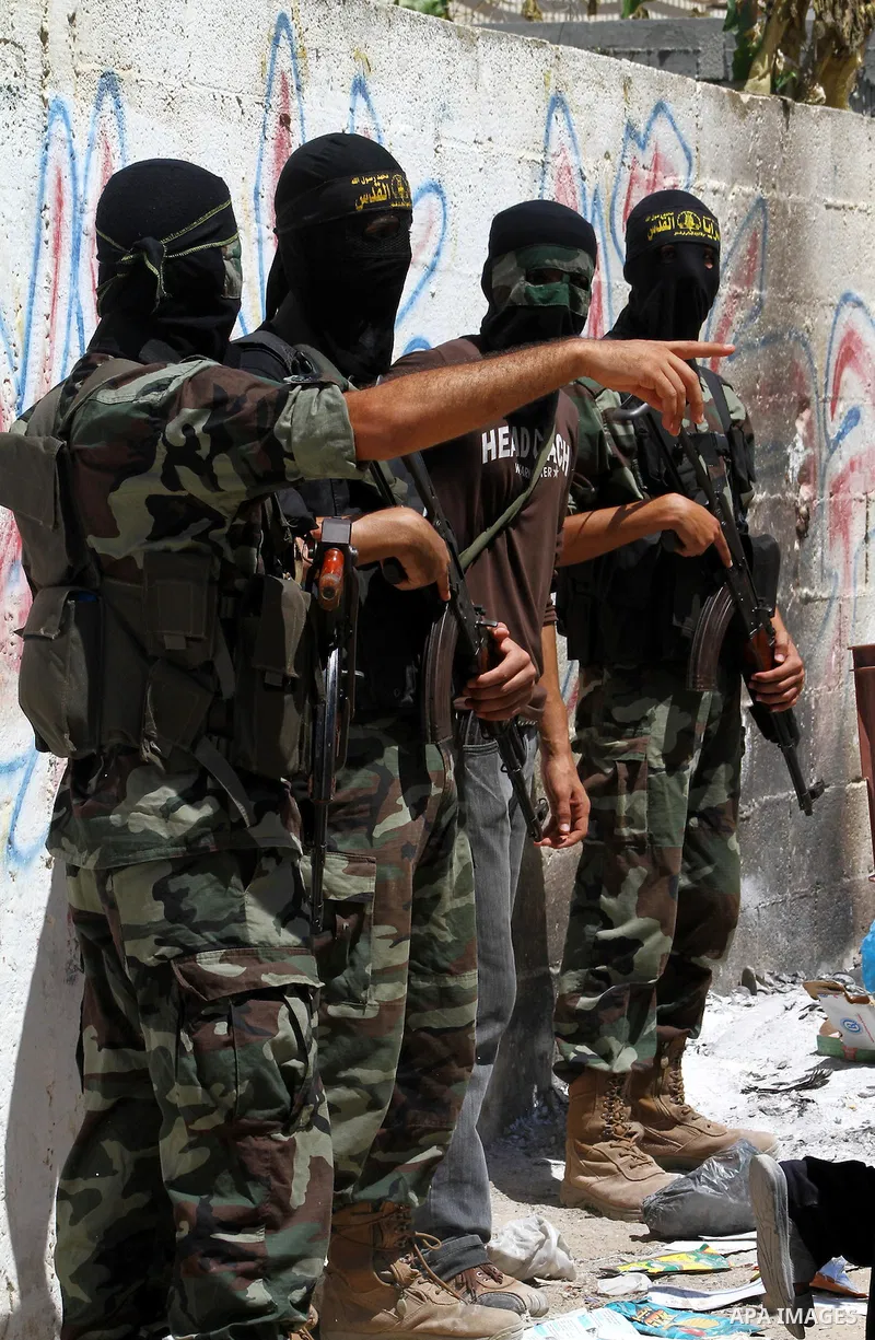 Palestinian militants of Islamic Jihad take part in the funeral of Alaa Hamdan and Saleem al-Arabid in Gaza City on August, 26,2011 after Palestinian groups in the Gaza Strip agreed on a new ceasefire after days of deadl...