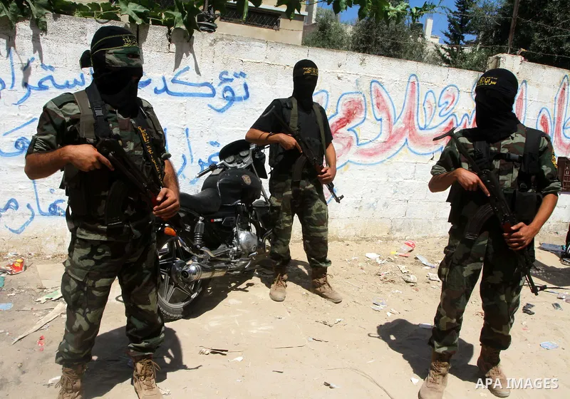Palestinian militants of Islamic Jihad take part in the funeral of Alaa Hamdan and Saleem al-Arabid in Gaza City on August, 26,2011 after Palestinian groups in the Gaza Strip agreed on a new ceasefire after days of deadl...