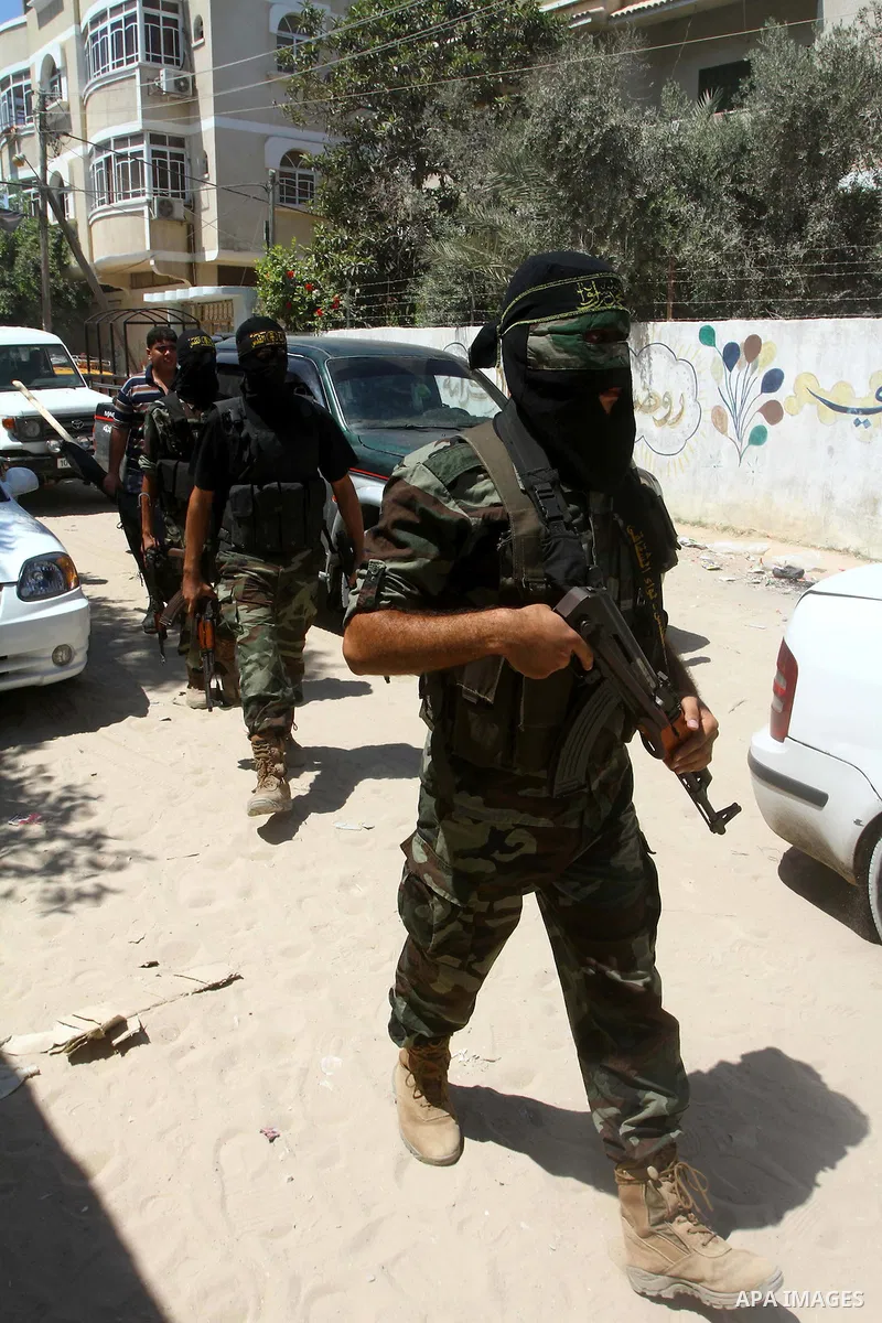 Palestinian militants of Islamic Jihad take part in the funeral of Alaa Hamdan and Saleem al-Arabid in Gaza City on August, 26,2011 after Palestinian groups in the Gaza Strip agreed on a new ceasefire after days of deadl...
