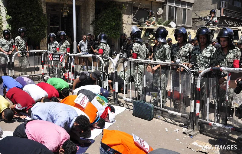 Egyptian protesters shout slogans against Israel during a protest in front of the Israeli Embassy in Cairo, Egypt, Friday, Aug.26, 2011. Hundreds of Egyptians protest the deaths of Egyptian security forces killed in a sh...
