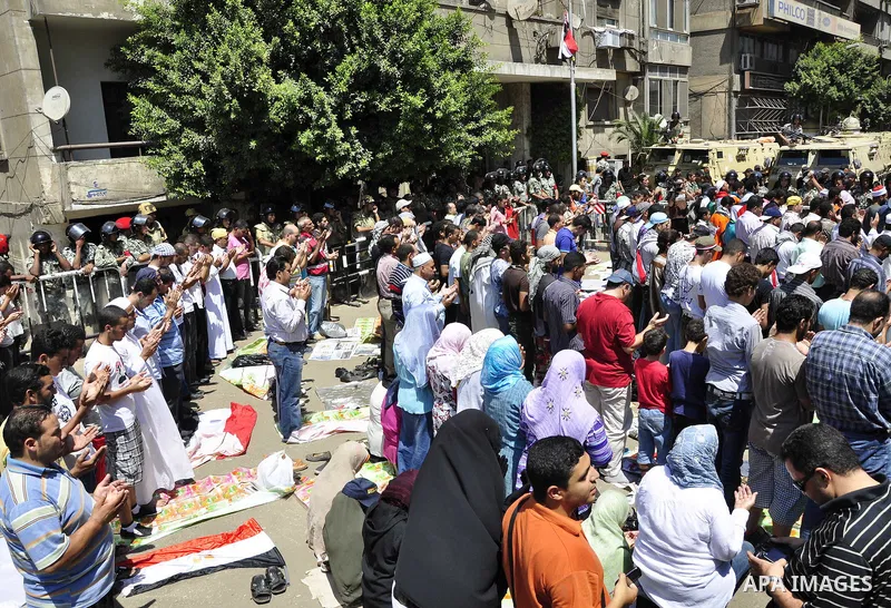 Egyptian protesters shout slogans against Israel during a protest in front of the Israeli Embassy in Cairo, Egypt, Friday, Aug.26, 2011. Hundreds of Egyptians protest the deaths of Egyptian security forces killed in a sh...