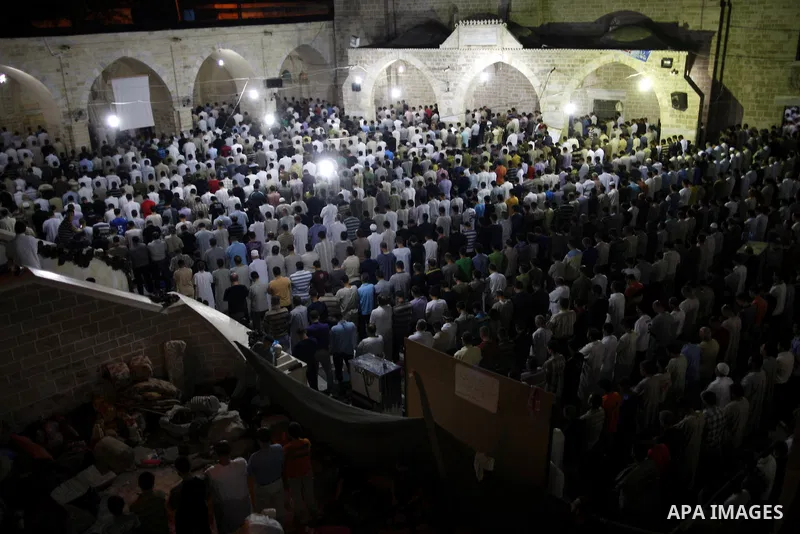 Palestinian Muslim worshippers pray during Laylat Al Qadr prayers on the 27th day of the holy fasting month of Ramadan in main mosque of Al Emari in Gaza City, Friday, Aug. 27, 2011. Laylat Al Qadr, the most important pr...