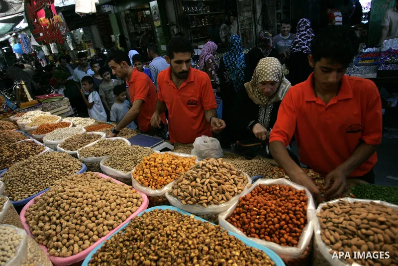 Palestinians shop for food as Muslims shop ahead of the Eid al-Fitr celebrations in Rafah, southern Gaza Strip on Aug. 28, 2011. Muslims in the region will celebrate the Eid al-Fitr holiday starting with the sighting of...
