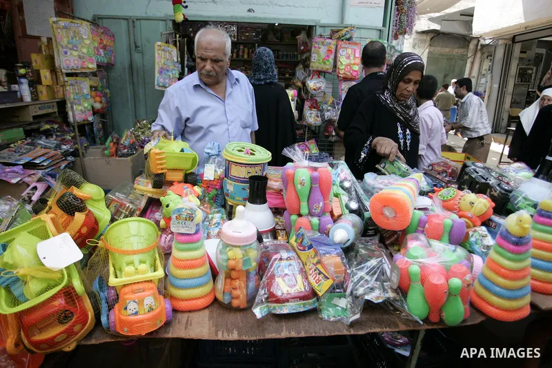 Palestinians buy plastic toys as Muslims shop ahead of the Eid al-Fitr celebrations in Rafah, southern Gaza Strip on Aug. 28, 2011. Muslims in the region will celebrate the Eid al-Fitr holiday starting with the sighting...