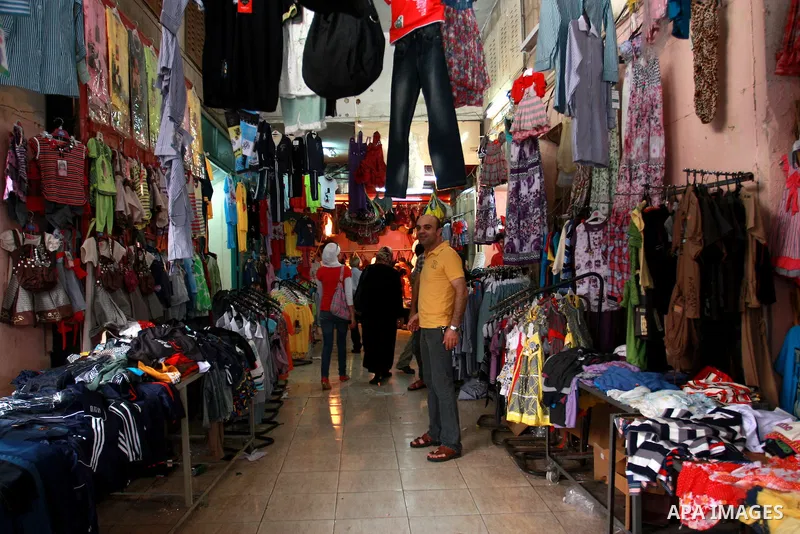 Palestinians shop for clothes at a market, as Muslims shop ahead of the Eid al-Fitr celebrations in the West Bank city of Nablus on Aug. 28, 2011. Muslims in the region will celebrate the Eid Al-Fitr with the sighting of...