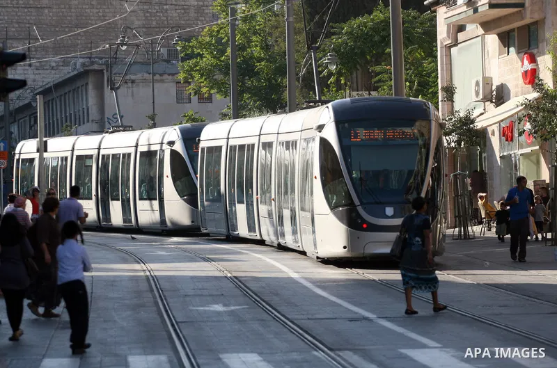 Palestinian and israeli Passengers ride a light rail train, Ten days after opened to the public in Jerusalem, on Aug. 29, 2011. The Jerusalem municipality said that a long-awaited light rail system is beginning operation...
