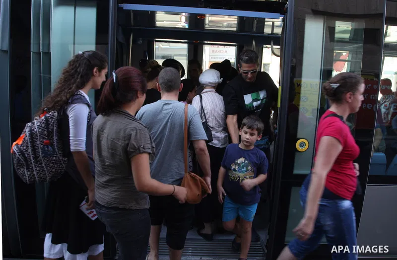Palestinian and israeli Passengers ride a light rail train, Ten days after opened to the public in Jerusalem, on Aug. 29, 2011. The Jerusalem municipality said that a long-awaited light rail system is beginning operation...