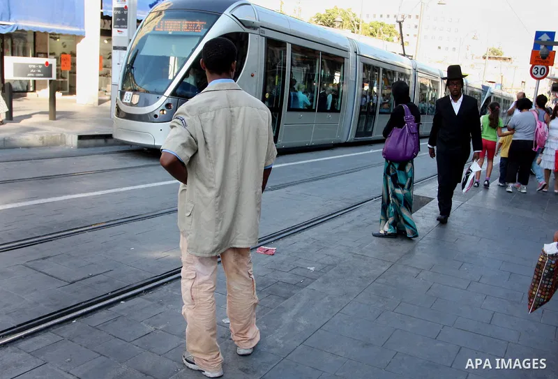 Palestinian and israeli Passengers ride a light rail train, Ten days after opened to the public in Jerusalem, on Aug. 29, 2011. The Jerusalem municipality said that a long-awaited light rail system is beginning operation...