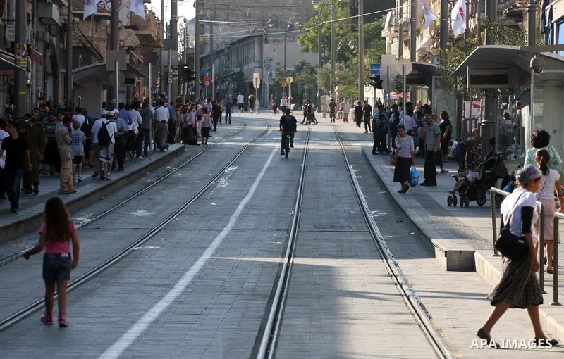 Palestinian and israeli Passengers ride a light rail train, Ten days after opened to the public in Jerusalem, on Aug. 29, 2011. The Jerusalem municipality said that a long-awaited light rail system is beginning operation...