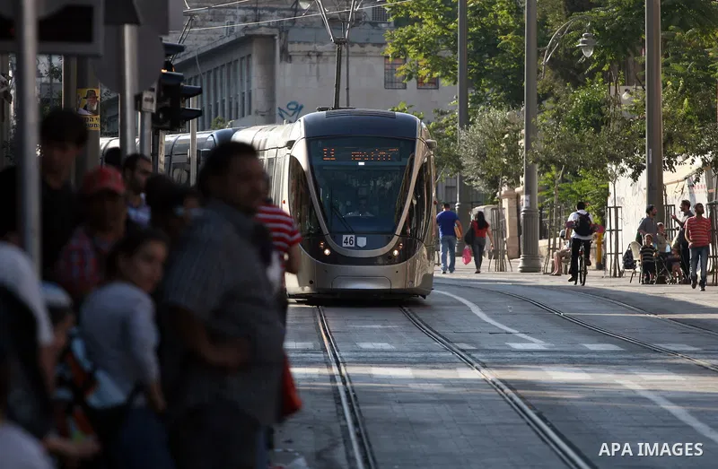 Palestinian and israeli Passengers ride a light rail train, Ten days after opened to the public in Jerusalem, on Aug. 29, 2011. The Jerusalem municipality said that a long-awaited light rail system is beginning operation...