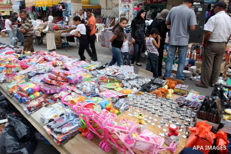 Palestinian Muslims shop in downtown Ramallah in the West Bank on August 29, 2011, ahead of the upcoming Eid al-Fitr which marks the end of the holy month of Ramadan. Photo by Issam Rimawi