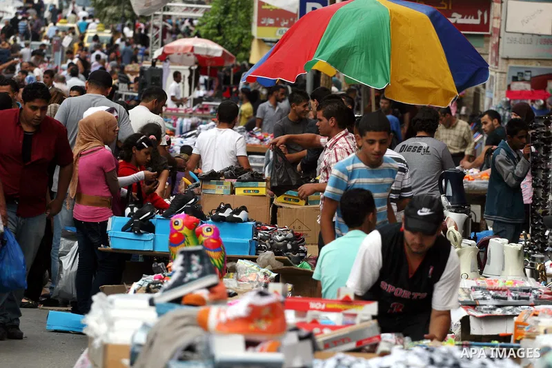 Palestinian Muslims shop in downtown Ramallah in the West Bank on August 29, 2011, ahead of the upcoming Eid al-Fitr which marks the end of the holy month of Ramadan. Photo by Issam Rimawi
