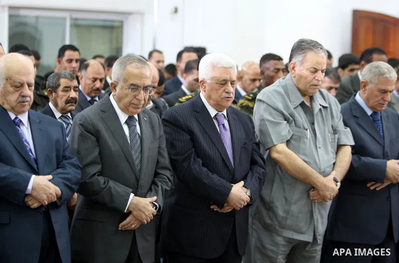 Palestinian president Mahmoud Abbas (Abu Mazen) attends the prayer of Eid al-Fitr in the West Bank city of Ramallah August 30, 2011. Eid al-Fitr marks the end of the Muslim holy month of Ramadan. Photo by Thaer Ganaim