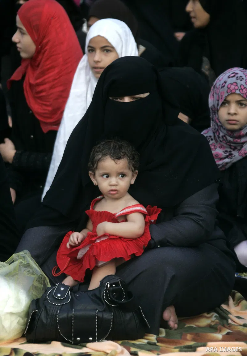 Palestinians attend an open air morning prayer to celebrate Eid al-Fitr in Khan Yunis town the southern Gaza Strip on August 30, 2011. The Palestinian Territories, along with other neighboring and Gulf states, announced...