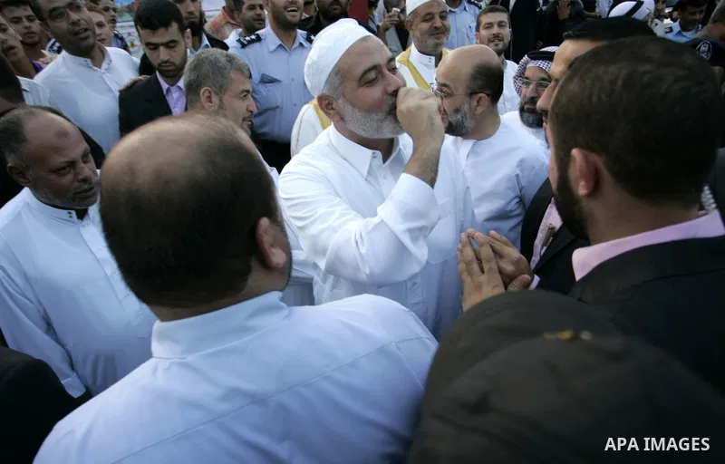 Ismail Haniya, Palestinian Prime Minister in the Gaza Strip, waves to the crowds after an open air morning prayer to celebrate Eid al-Fitr in Khan Yunis town the southern Gaza Strip on August 30, 2011. The Palestinian Te...