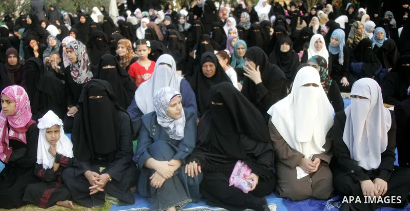 Palestinians attend an open air morning prayer to celebrate Eid al-Fitr in Khan Yunis town the southern Gaza Strip on August 30, 2011. The Palestinian Territories, along with other neighboring and Gulf states, announced...