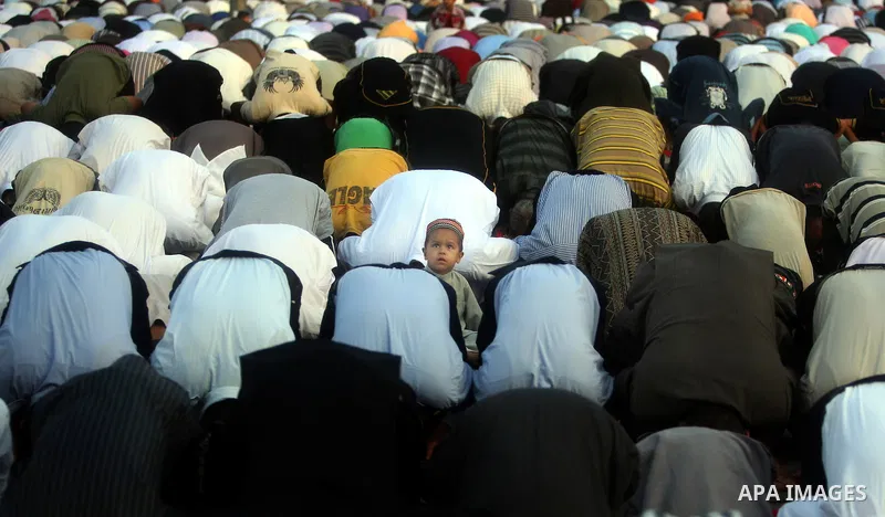 Palestinians attend an open air morning prayer to celebrate Eid al-Fitr in Khan Yunis town the southern Gaza Strip on August 30, 2011. The Palestinian Territories, along with other neighboring and Gulf states, announced...