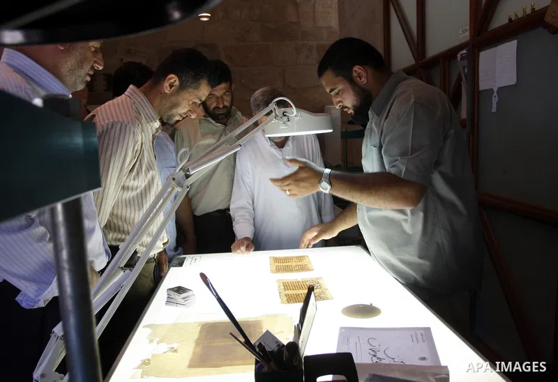 Palestinians work to rewrite manuscripts in the Manuscript Center at Al-Aqsa Mosque in Jerusalem on September 2, 2011 .The Manuscript Center Aqsa Mosque first of its kind in the Middle East and fourth in the world, as cl...