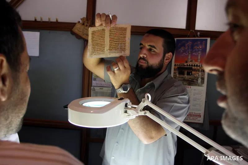Palestinians work to rewrite manuscripts in the Manuscript Center at Al-Aqsa Mosque in Jerusalem on September 2, 2011 .The Manuscript Center Aqsa Mosque first of its kind in the Middle East and fourth in the world, as cl...