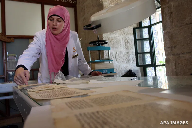 Palestinians work to rewrite manuscripts in the Manuscript Center at Al-Aqsa Mosque in Jerusalem on September 2, 2011 .The Manuscript Center Aqsa Mosque first of its kind in the Middle East and fourth in the world, as cl...