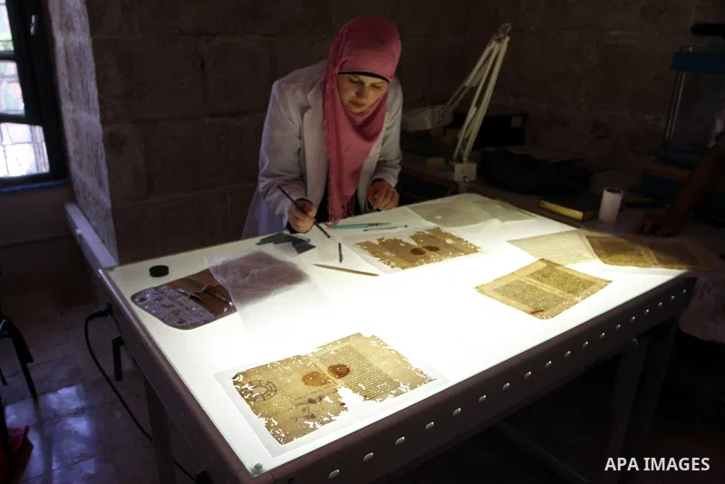 Palestinians work to rewrite manuscripts in the Manuscript Center at Al-Aqsa Mosque in Jerusalem on September 2, 2011 .The Manuscript Center Aqsa Mosque first of its kind in the Middle East and fourth in the world, as cl...