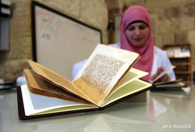 Palestinians work to rewrite manuscripts in the Manuscript Center at Al-Aqsa Mosque in Jerusalem on September 2, 2011 .The Manuscript Center Aqsa Mosque first of its kind in the Middle East and fourth in the world, as cl...