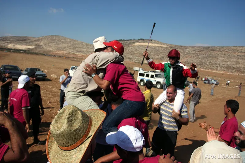 Palestinian jockeys compete during a horse race in the West Bank village of Abu Falah, near the town of Ramallah ,on 02 September 2011. Some 60 horses in different heats participated in races through the day, attracting...