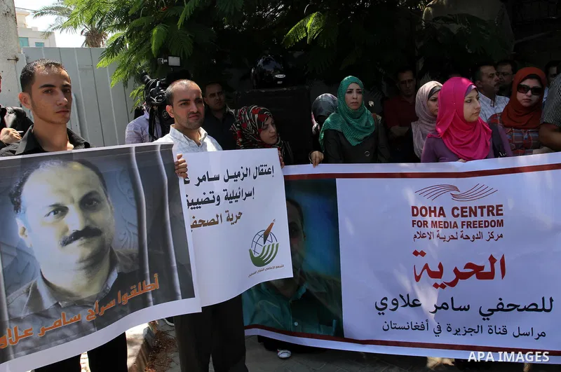 Palestinian journalists take part in a protest in support with the journalist, Samir Allawi, Al-Jazeera correspondent in Afghanistan and his fellow journalists detained in Israeli prisons, infront of UNRWA headquarters i...