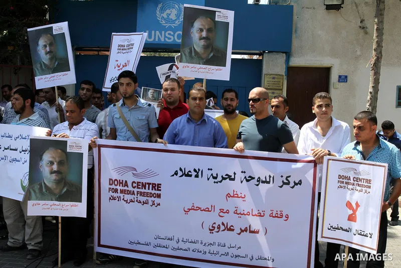 Palestinian journalists take part in a protest in support with the journalist, Samir Allawi, Al-Jazeera correspondent in Afghanistan and his fellow journalists detained in Israeli prisons, infront of UNRWA headquarters i...