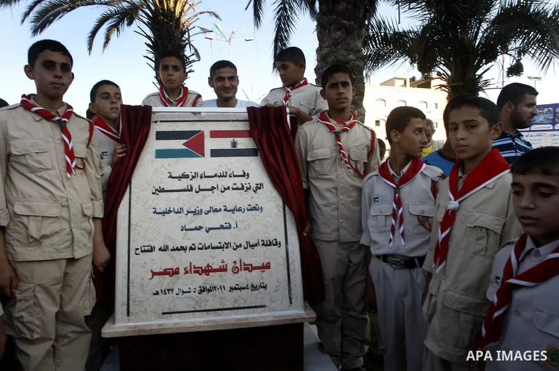 Members of Palestinian scouts, members of ''Miles of Smiles" convoy and other pro-Palestinian activists attend the inauguration ceremony of the memorial for Egyptian soldiers who killed by Israeli army on the border betw...