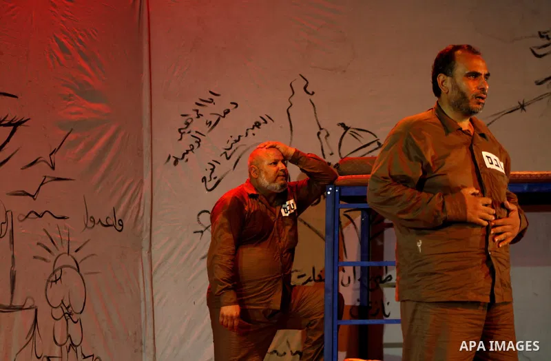 Palestinian actors perform at al-Shawwa theatre a play appear the hard life of Palestinian prisoners inside the Israeli jails, in Gaza city on Sep 3,2011. About 7,500 Palestinian prisoners are held in Israeli jails, acco...
