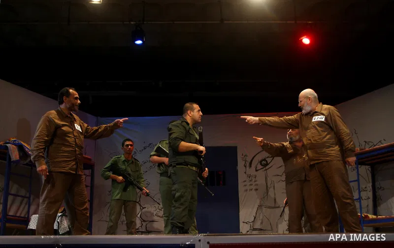 Palestinian actors perform at al-Shawwa theatre a play appear the hard life of Palestinian prisoners inside the Israeli jails, in Gaza city on Sep 3,2011. About 7,500 Palestinian prisoners are held in Israeli jails, acco...