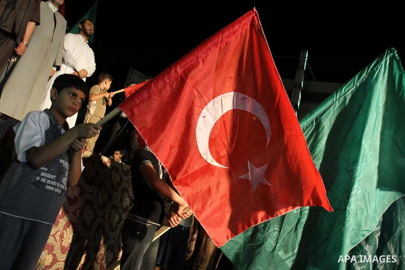 Palestinians wave with their national flag and Turkish flag during a rally in support to Turkish decision in Gaza city on Sep. 3,2011. Turkey said Friday it was expelling the Israeli ambassador and cutting military ties...