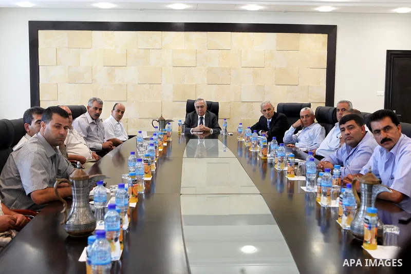 Palestinian Prime Minister Salam Fayyad with the representatives of the Popular Resistance Committees against the Wall and Settlements, in the West Bank town of Ramallah, on 05 September 2011, a day after Palestinian off...