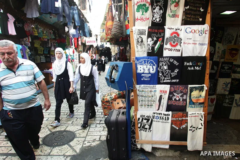Palestinian students walk in a street after they returned back from their school on the second day of the new studing year, in Jerusalem's old city on Sep. 5,2011. Photo by Mahfouz Abu Turk