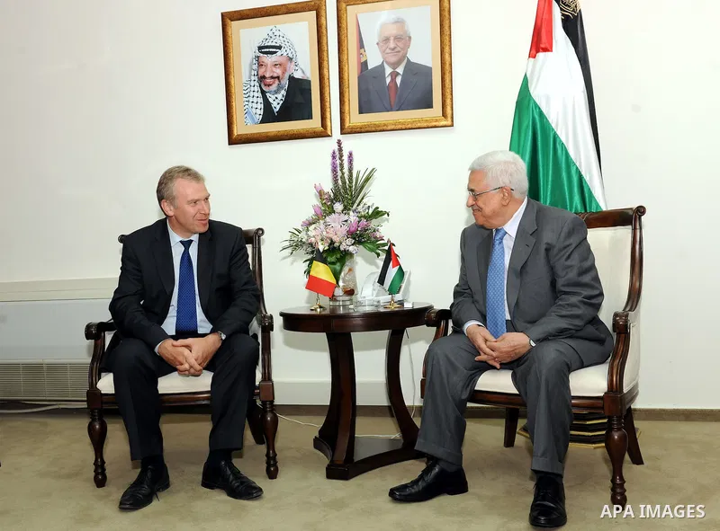 Palestinian President Mahmoud Abbas speaks with Belgium's Prime Minister Yves Leterme during their meeting in the West Bank city of Ramallah September 5, 2011. Photo by Mufeed Abu Hasnah