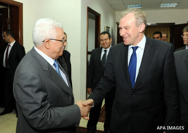 Palestinian President Mahmoud Abbas shakes hand with Belgium's Prime Minister Yves Leterme following their meeting in the West Bank city of Ramallah September 5, 2011. Photo by Mufeed Abu Hasnah