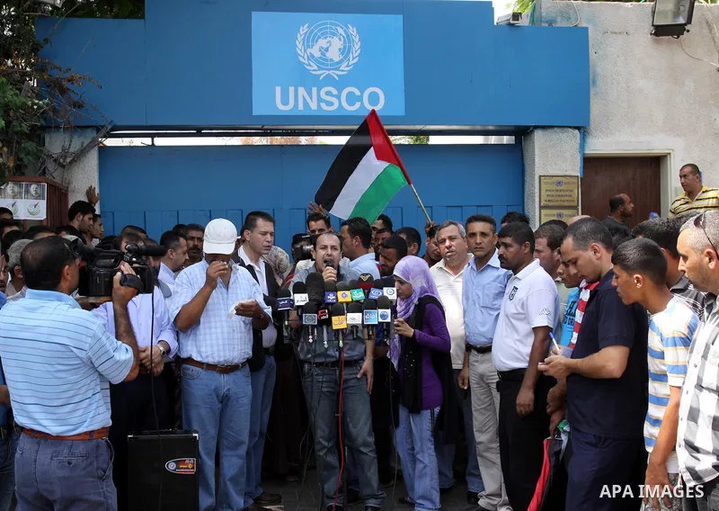 A Palestinian member of the Union of Agricultural Work Committees delivers speech during a protest in front of UNRWA headquarters, to object about the Palmer report in Gaza city on Sep. 6, 2011 . Photo by Mohammed Asad