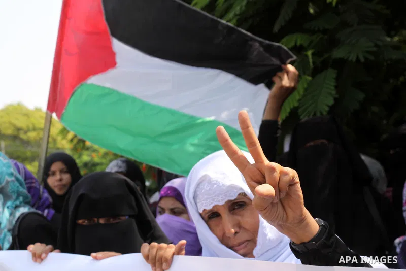Palestinians of the Union of Agricultural Work Committees take part in a protest in front of UNRWA headquarters, to object about the Palmer report in Gaza city on Sep. 6, 2011 . Photo by Mohammed Asad