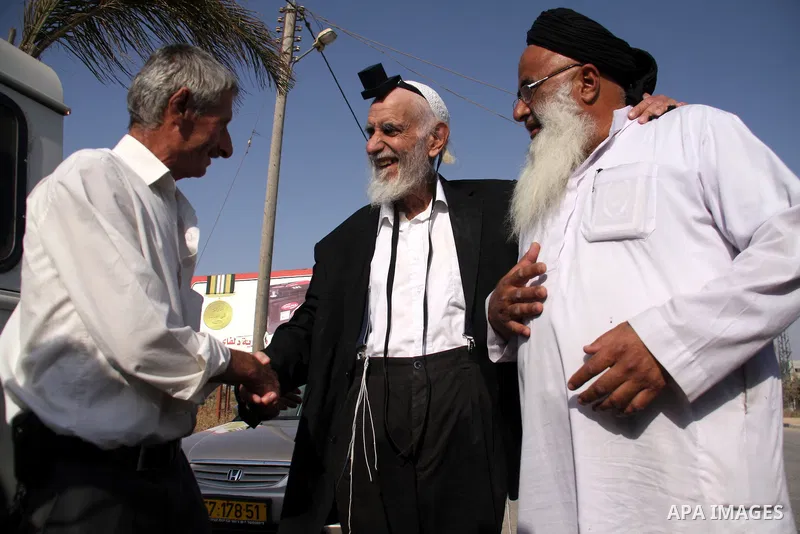 Jewish rabbi Menachem Froman leads a reconciliation visit of Jewish settlers to the West Bank village of Qusra, a day after the local mosque was vandalized, Tuesday, Sept. 6, 2011. The mosque was torched Monday after Isr...
