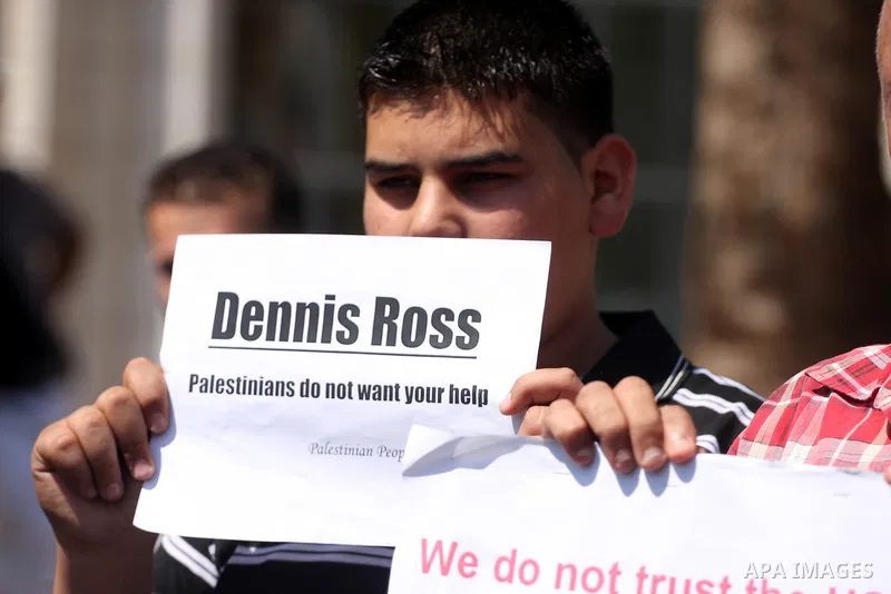 Palestinians stage a protest against US policies towards the Palestinians, ahead a visit by senior US envoys, in the West Bank city of Ramallah on Sep. 7, 2011. President Mahmud Abbas (Abu Mazen) during holding talks wit...