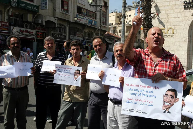 Palestinians stage a protest against US policies towards the Palestinians, ahead a visit by senior US envoys, in the West Bank city of Ramallah on Sep. 7, 2011. President Mahmud Abbas (Abu Mazen) during holding talks wit...