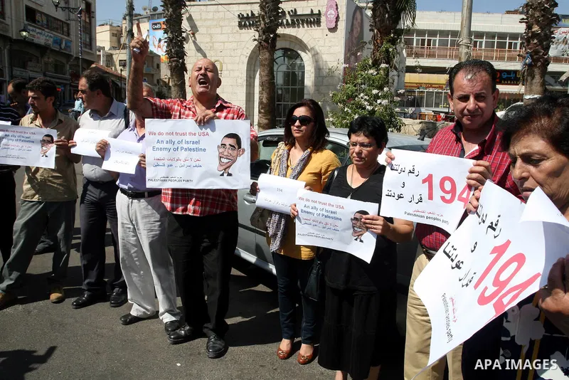 Palestinians stage a protest against US policies towards the Palestinians, ahead a visit by senior US envoys, in the West Bank city of Ramallah on Sep. 7, 2011. President Mahmud Abbas (Abu Mazen) during holding talks wit...