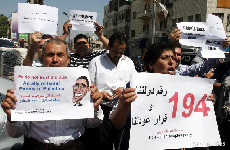 Palestinians stage a protest against US policies towards the Palestinians, ahead a visit by senior US envoys, in the West Bank city of Ramallah on Sep. 7, 2011. President Mahmud Abbas (Abu Mazen) during holding talks wit...