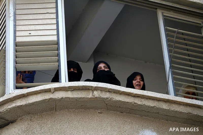 Relatives of the Palestinian Popular Resistance Committees militant, Khaled Abu Samhoud, who was killed in Israeli airstrike, mourn during his funeral in the southern Gaza Strip city of Khan Younis, on Sept. 7, 2011. A P...