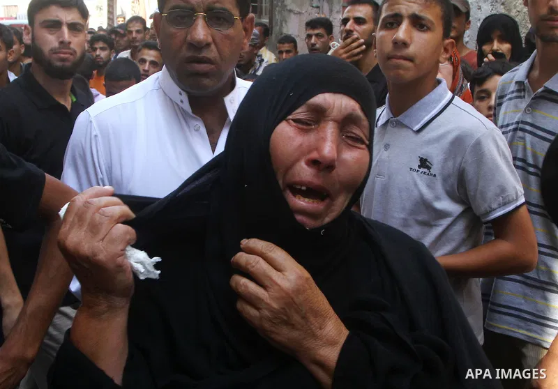 Relatives of the Palestinian Popular Resistance Committees militant, Khaled Abu Samhoud, who was killed in Israeli airstrike, mourn during his funeral in the southern Gaza Strip city of Khan Younis, on Sept. 7, 2011. A P...