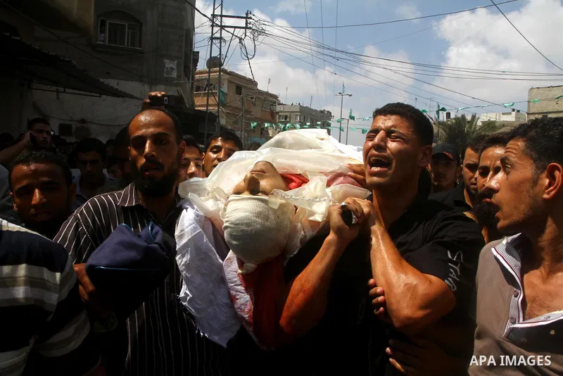 Palestinian mourners carry the body of the Popular Resistance Committees militant, Khaled Abu Samhoud, who was killed in Israeli airstrike, during his funeral in the southern Gaza Strip city of Khan Younis, Sept. 7, 2011...